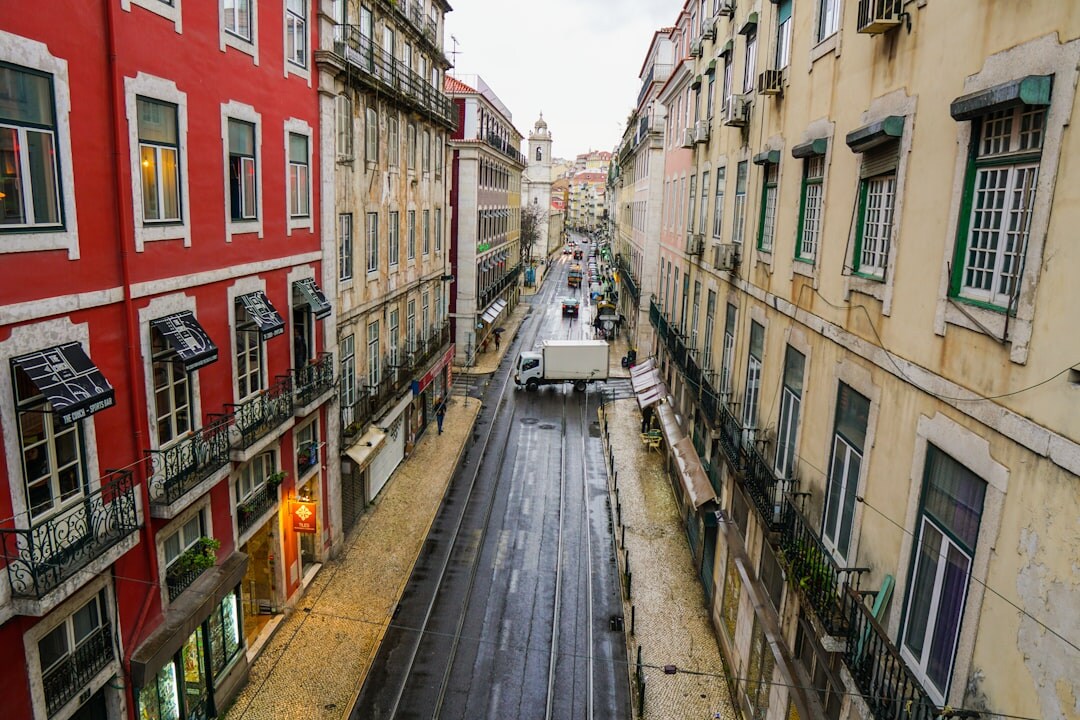 Traditional Lisbon street with colorful buildings and tiled facades